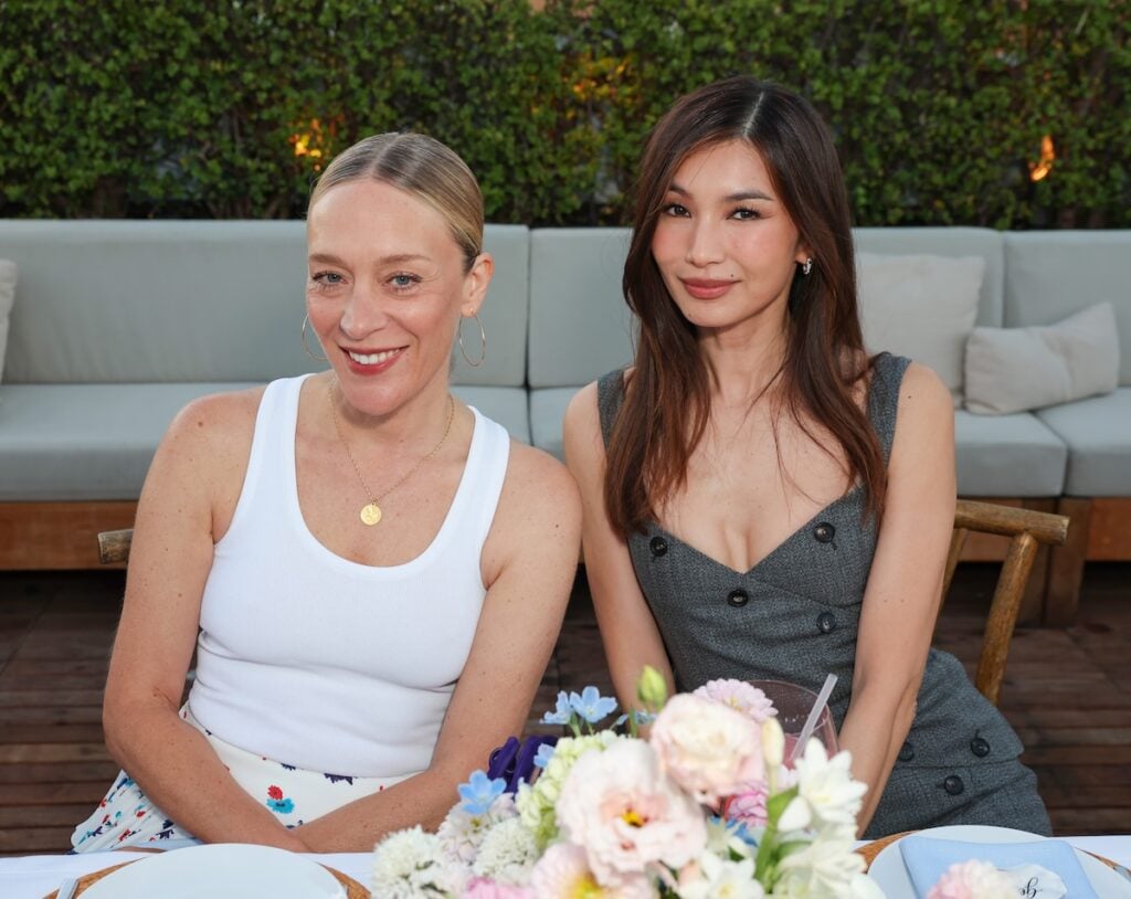 Close-up of Chloë Sevigny and Gemma Chan wearing Ferragamo Fall 2026 at The Five-Star Weekend dinner.